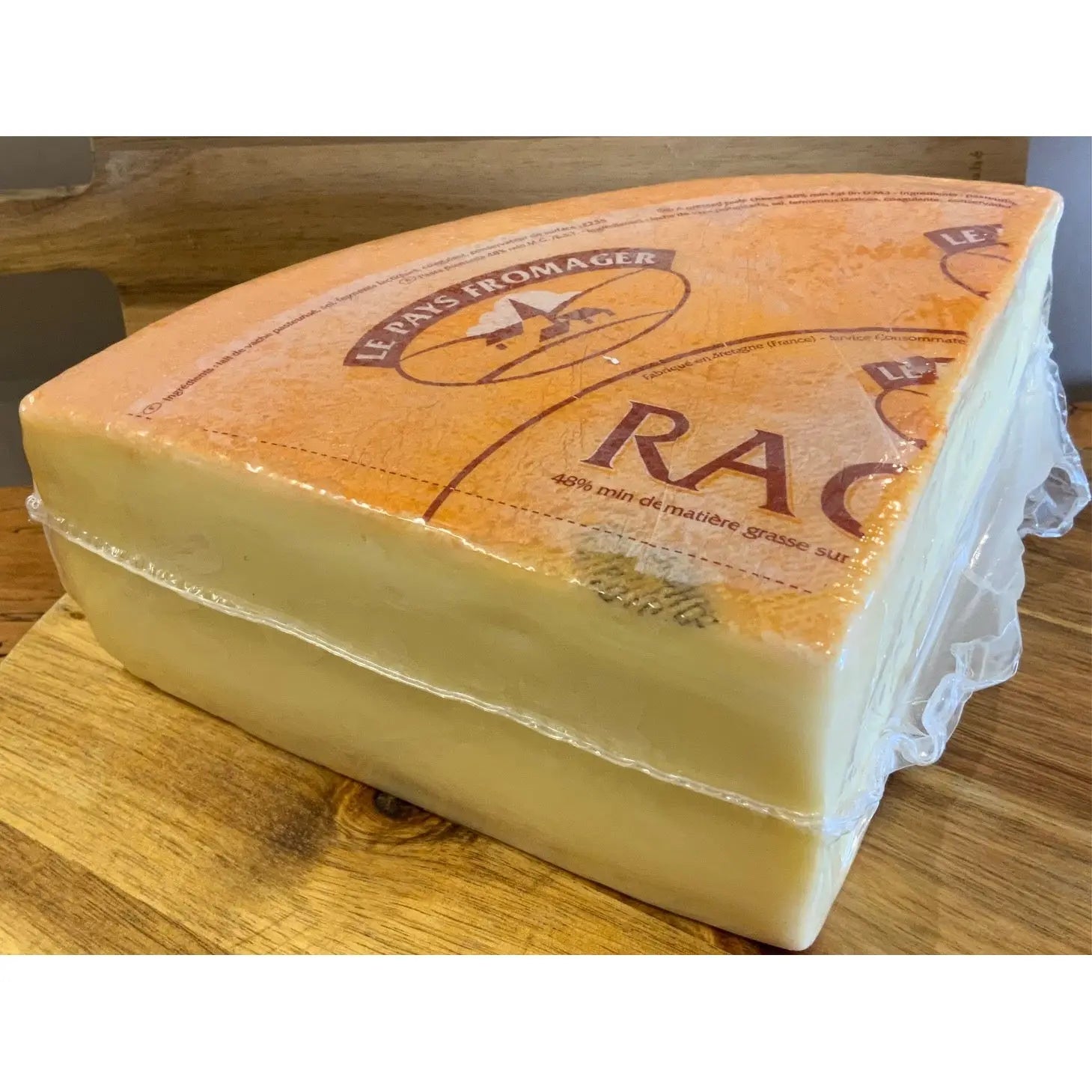 Quarter wheel of raclette cheese